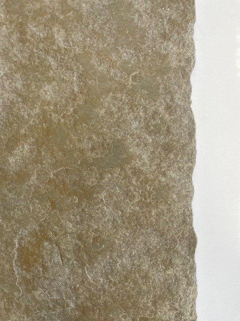 Close-up of Cathedral limestone flooring surface with rustic texture, natural variation and aged British flagstone character