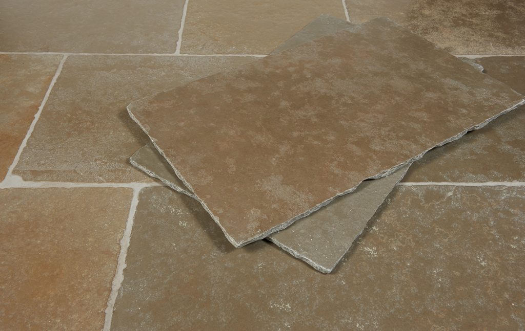 Cathedral limestone flooring installed in a traditional interior with rustic British stone flagstone appearance