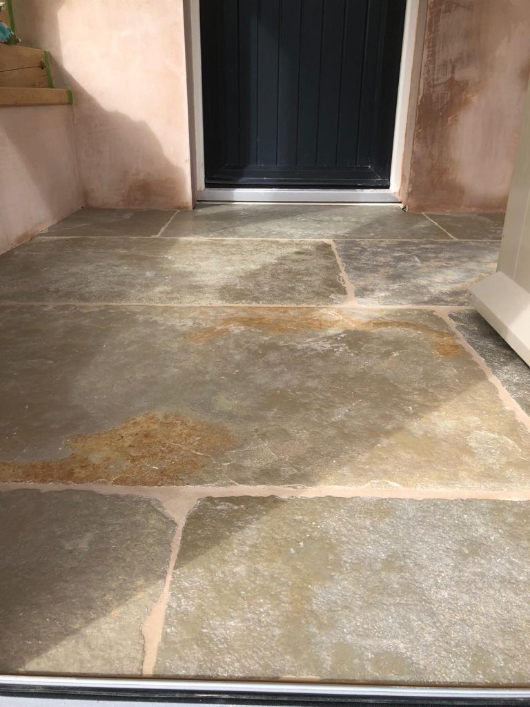 Cathedral limestone floor installation in Dorset traditional home