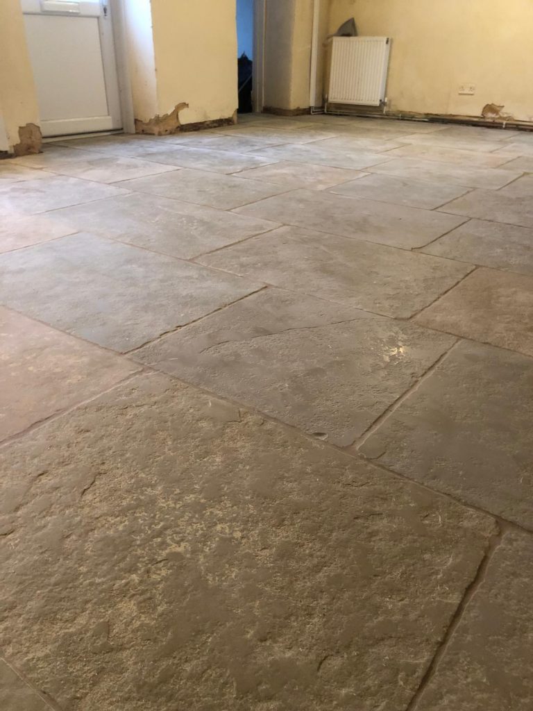 Cathedral limestone kitchen floor installation in Charlton Marshall