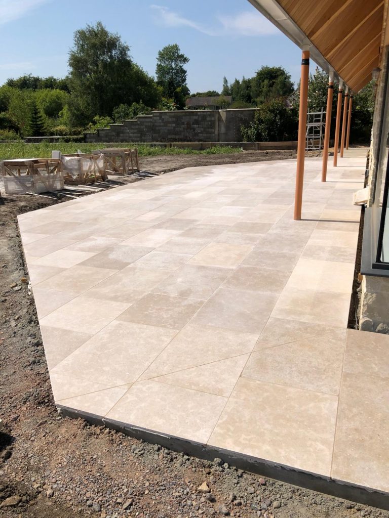 Heritage limestone patio installed in Tisbury