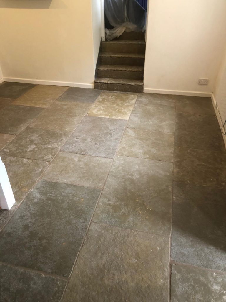 Cathedral Limestone flooring in a living room with four steps in Teffont, Wiltshire.