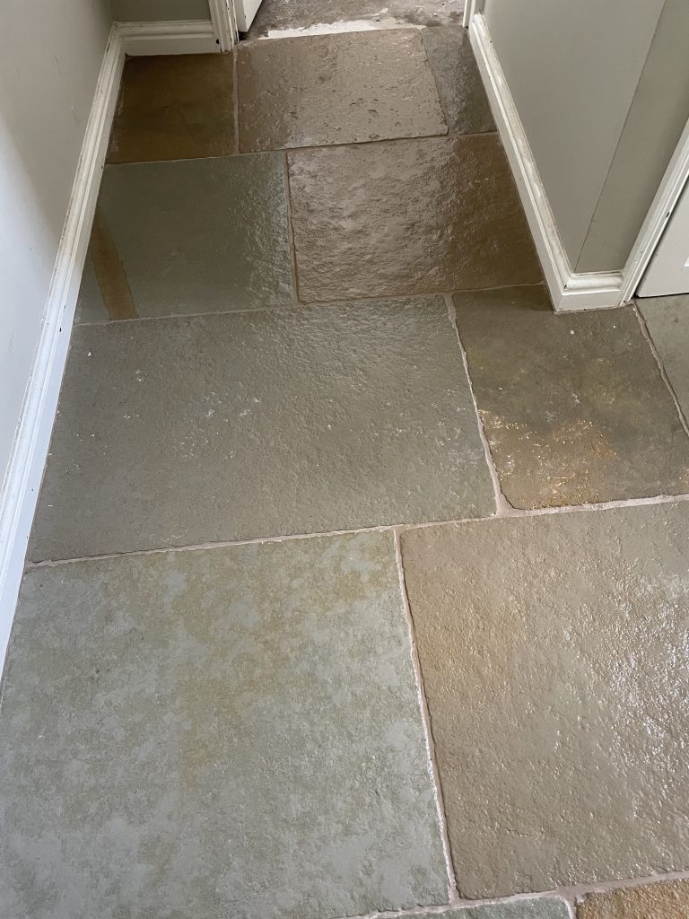 Close-up of Cathedral Limestone flooring detail in doorway threshold area in Bruton.