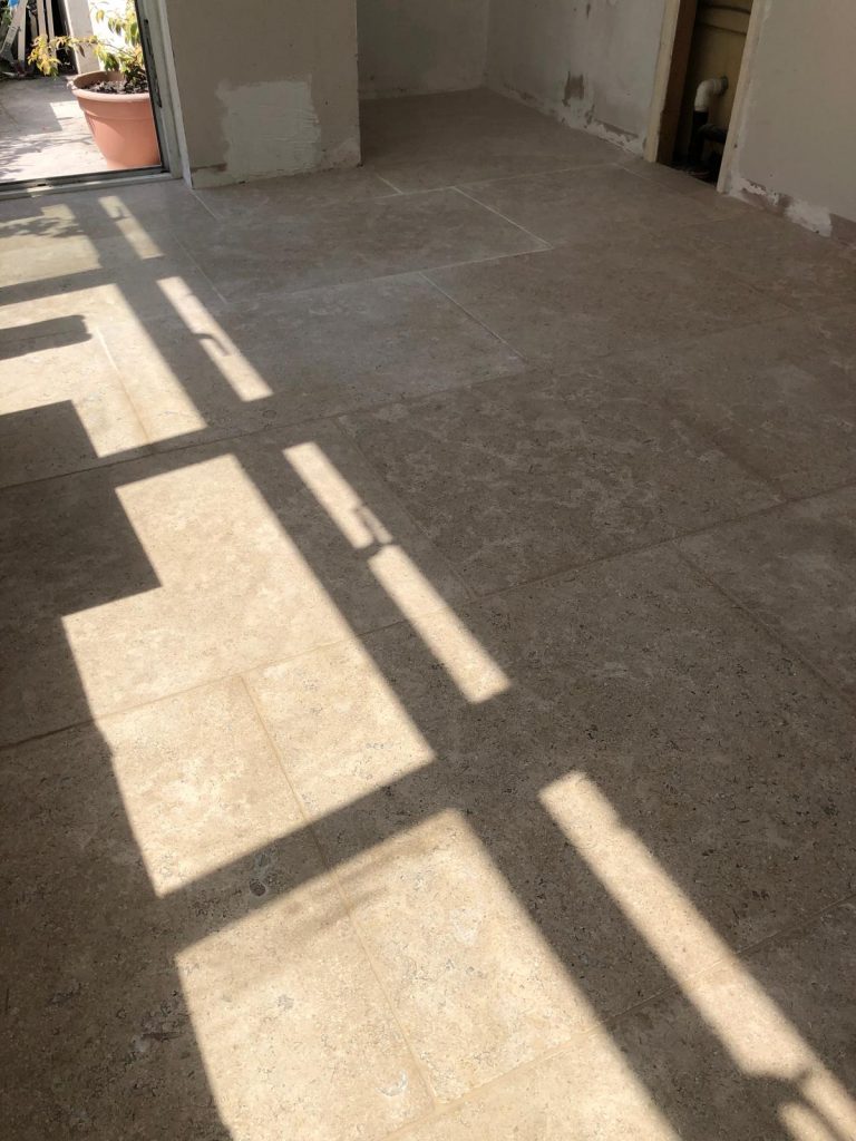 Refined Heritage limestone kitchen flooring with tumbled edges