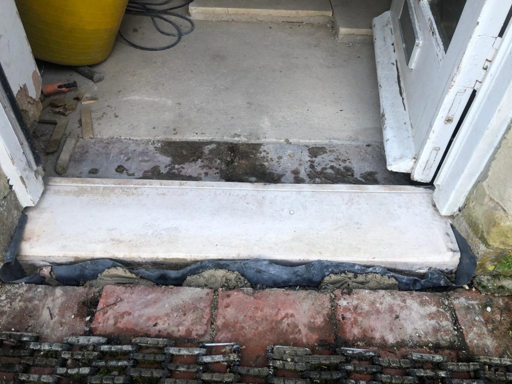 Marnhull stone door step threshold installed in the village of Marnhull, Dorset by Simali Stone.