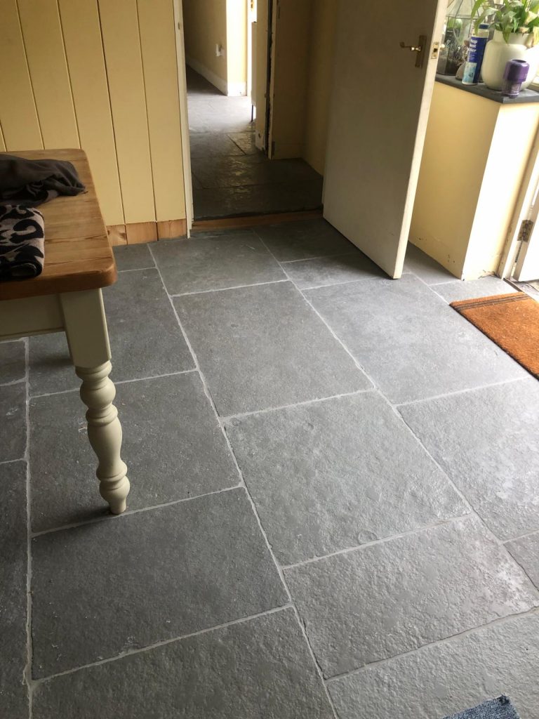 Southwell limestone flagstone floor prior to grouting, showing hand-cut edges and consistent neutral greys.