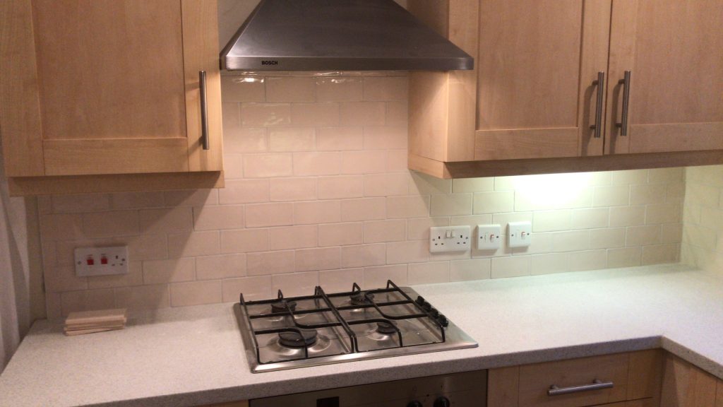 cooker hob splash showing ceramic tiles as wall covering