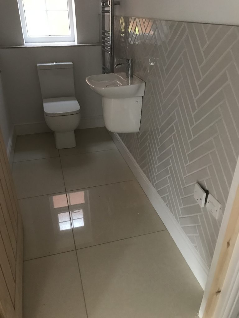 completed herringbone bathroom wall tiles with porcelain floor tiles Worcester

