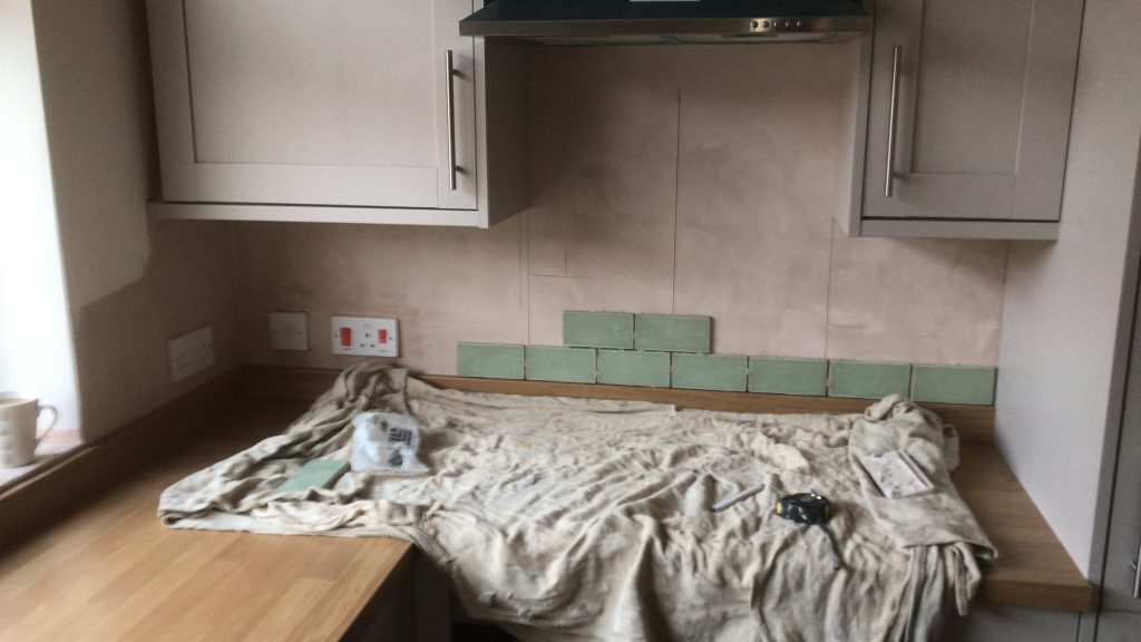 green porcelain tiles on cooker hood prior to installation