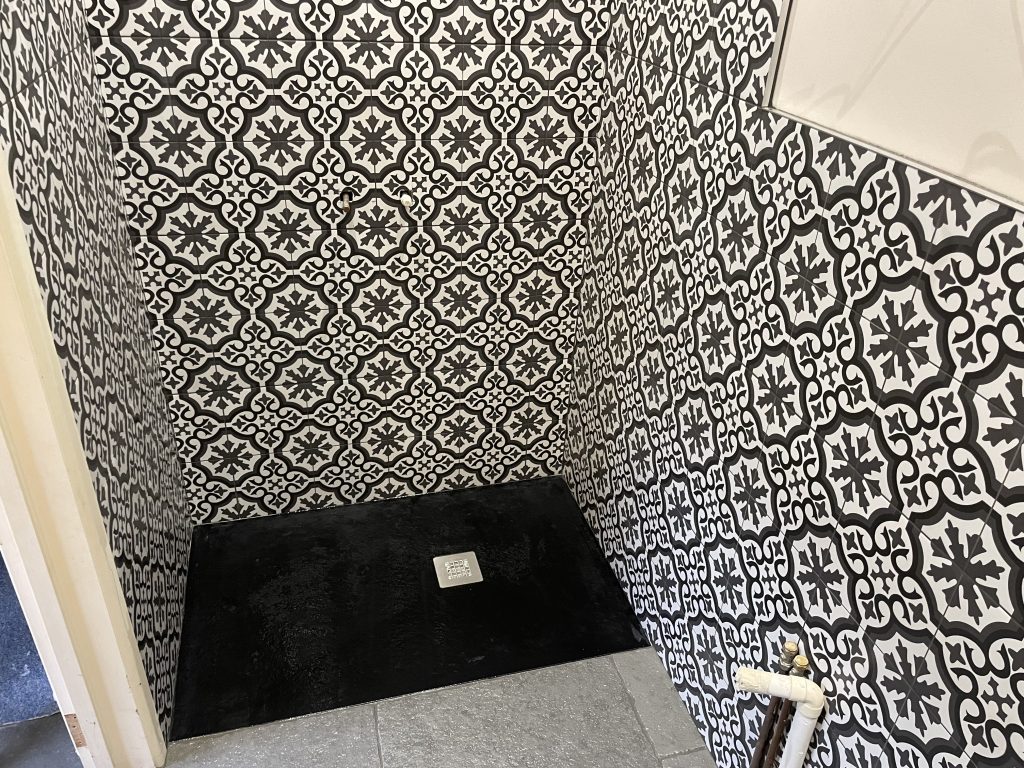 bathroom wall tiling Gillingham Dorset customers can see the finished shower walls and black shower tray