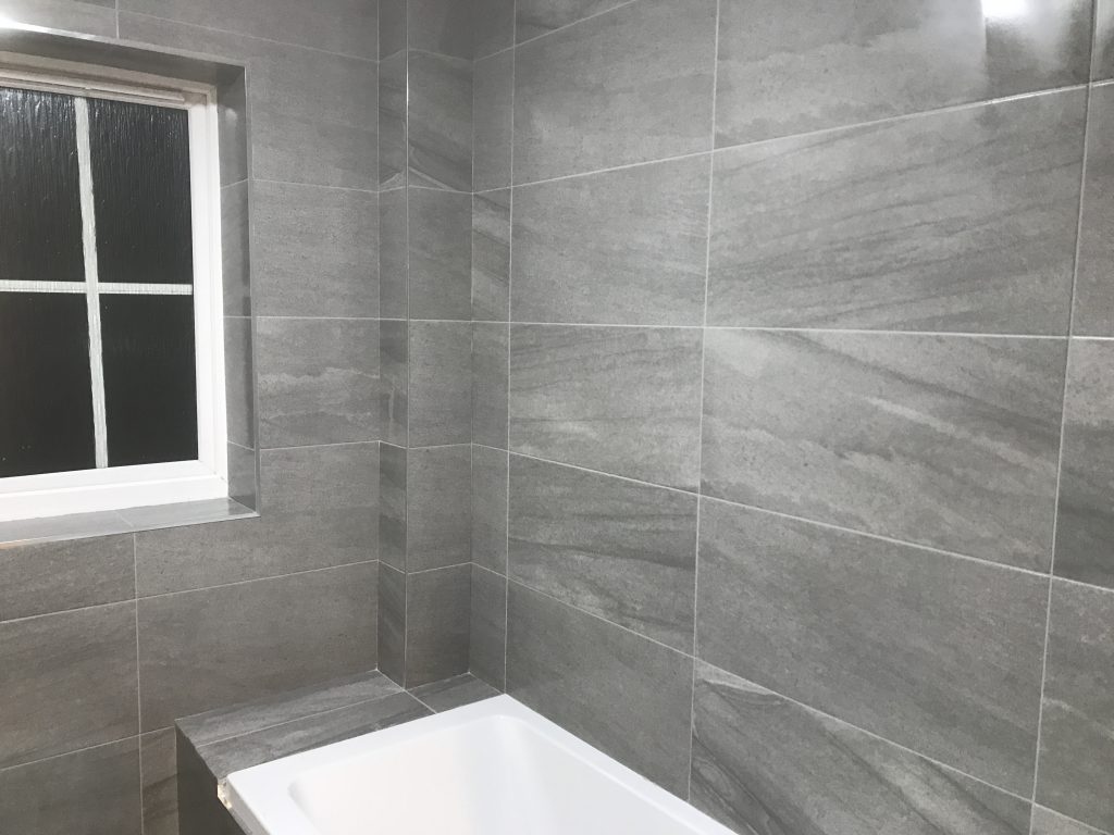 600x300 stone effect porcelain bathroom wall tiles installed in shower area Worcester