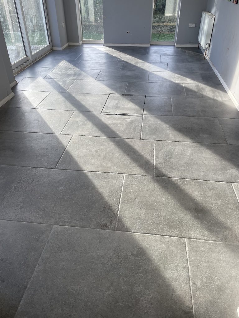 Stone flooring Bath showing a fully laid large format porcelain floor 