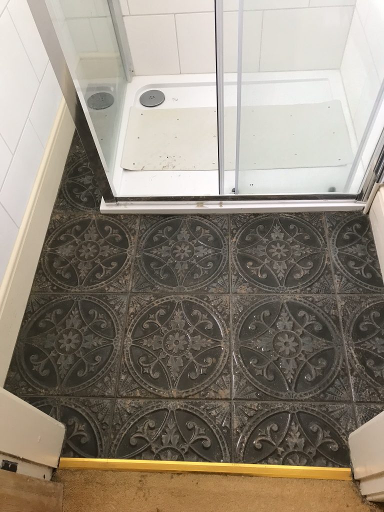 textured bathroom floor tiles with circular pattern detail porcelain tiles installation