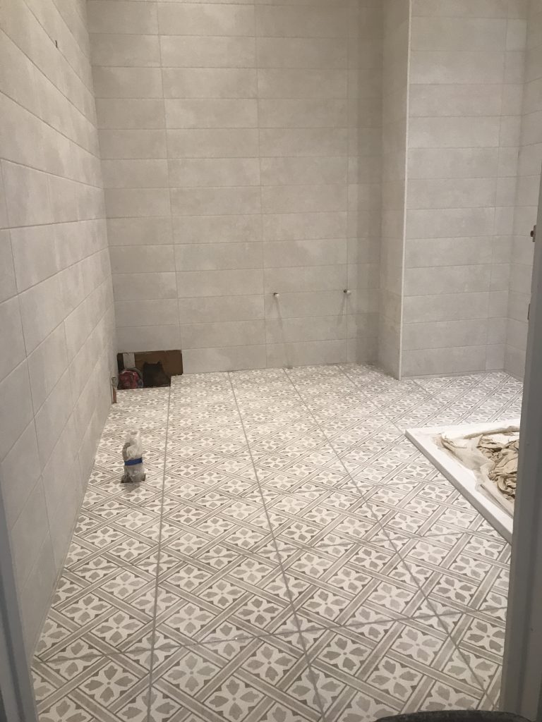 decorative 300x300 bathroom floor tiles fully grouted and finished installation