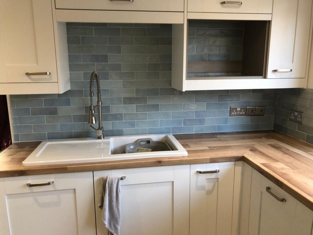 Kitchen tiling wincanton customers can see a kitchen tiled with blue wall tiles