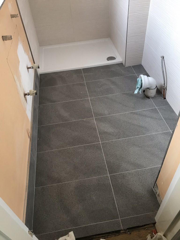 dark grey stone effect bathroom floor tiles 600x400 porcelain installation