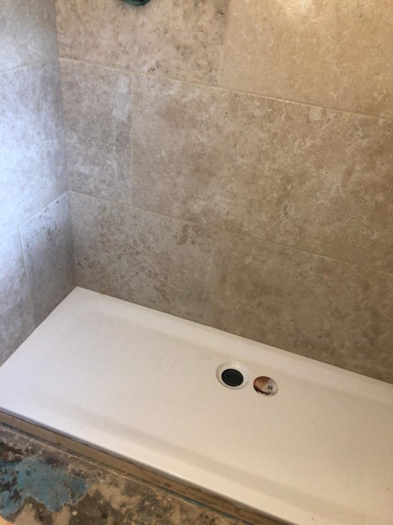 Large format bathroom wall tiles installed by Simali Stone