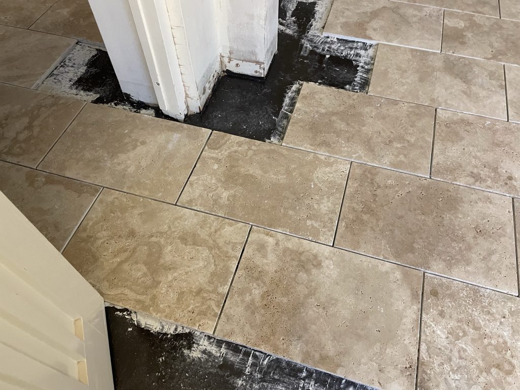 Stone flooring wincanton customers can now see the tiles been installed over the damp proof membrane.