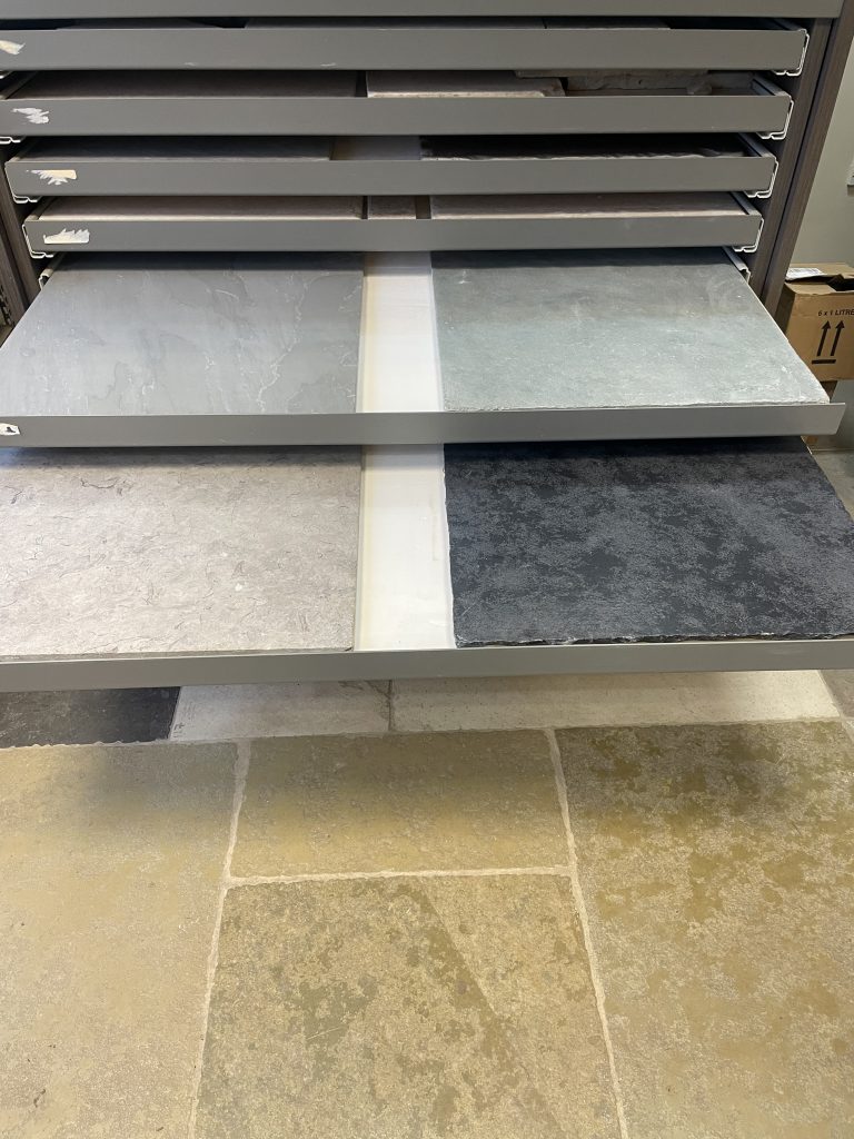 Limestone flagstones on display stands at Simali Stone, Shaftesbury