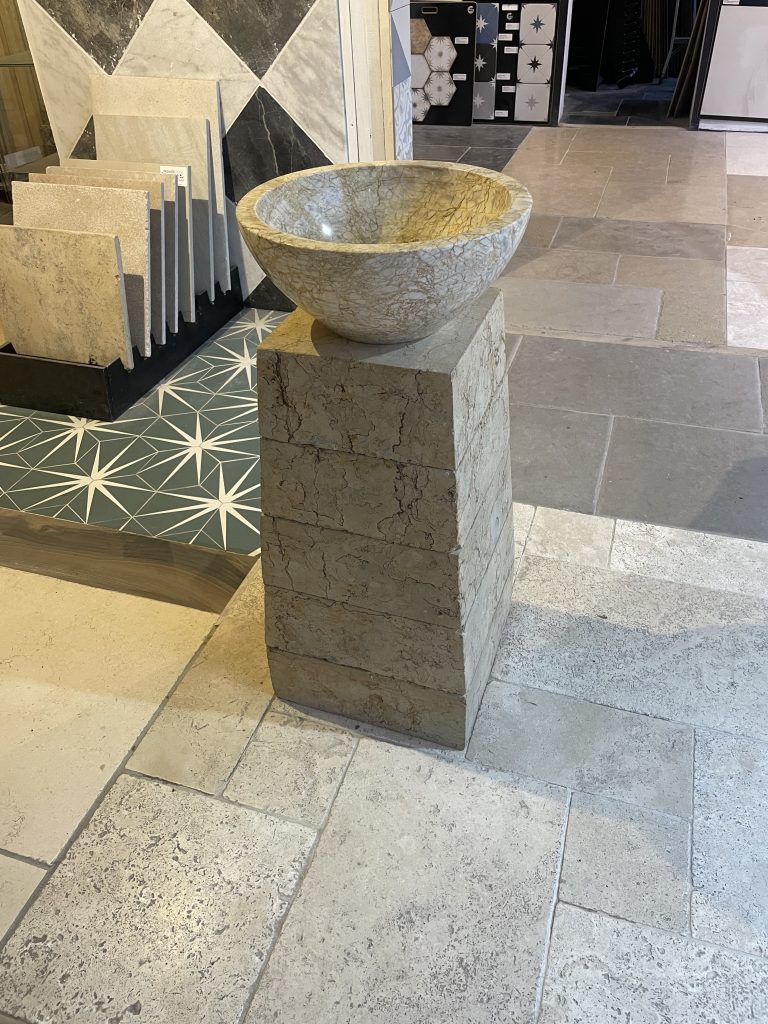 Stone Flooring Frome, Somerset showing a sink on a stone pile pedestal in Simali Stones showroom