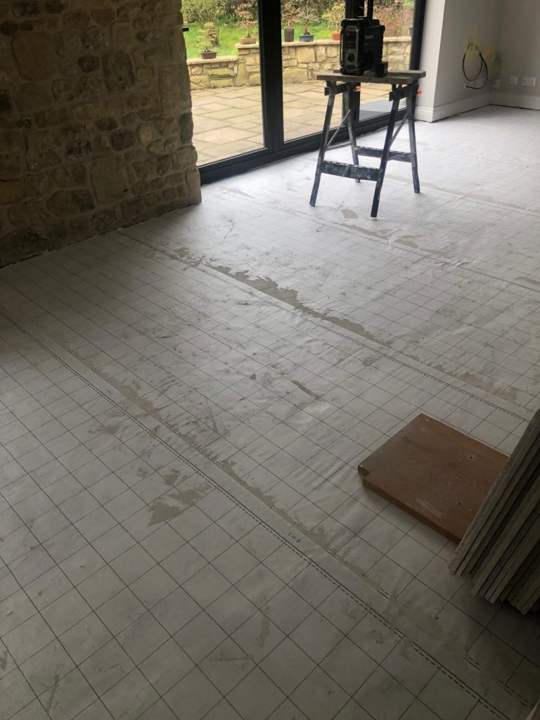 Anti Fracture mat installed to stop and cracks from under floor heating pipes.