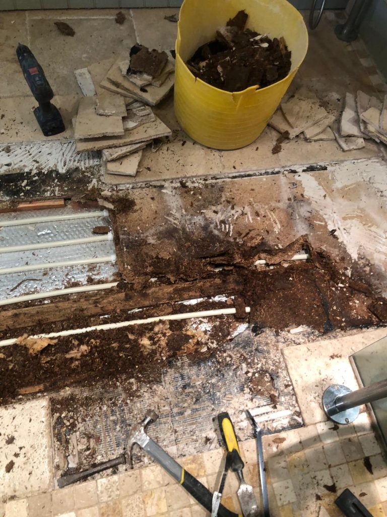 travertine bathroom floor Dorset installation before repair