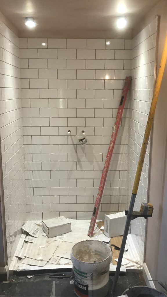 white ceramic bathroom wall tiles 150x300 installation in shower area Worcester
