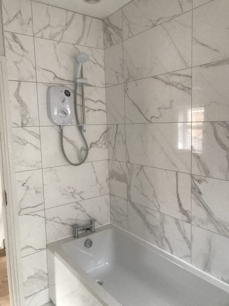 carrara style marble effect porcelain bathroom wall tiles with bath and shower Worcester

