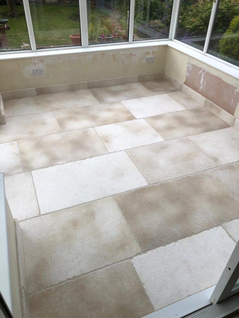 Bath Limestone showing cream flagstones with stone skirting boards, supplied and fitted by simali stone